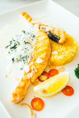 Grilled salmon fillet meat steak in white plate - Color Filter Processingの写真素材