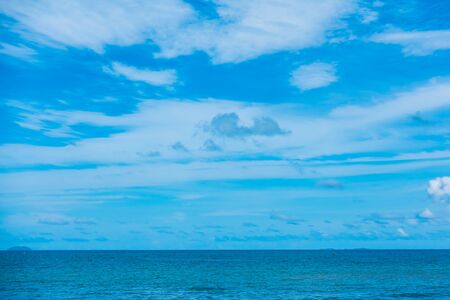 Beautiful beach with sea and ocean on blue sky background