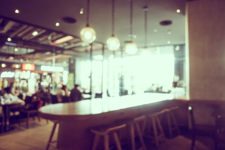 Abstract blur and defocused coffee shop and bakery cafe interior for background - Vintage Filterの写真素材