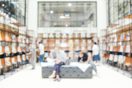 Abstract blur and defocused bookshelf in library interior for backgroundの写真素材