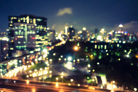 Abstract blur and defocused bangkok city at night in Thailand for background - Vintage Filterの写真素材