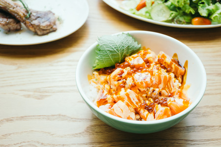 Raw fresh sashimi fish meat in rice bowl - Japanese food styleの写真素材