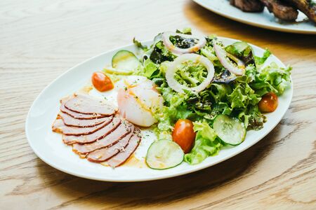 Duck breast meat with vegetable salad in white plate - Healthy food styleの写真素材