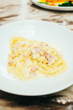 Spaghetti or Pasta carbonara cream sauce in white plate - Italian food styleの写真素材
