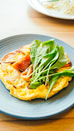 Fried eggs omelette for breakfast in white plate - Color Filter Processingの写真素材