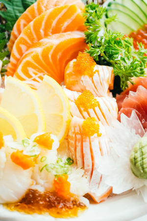 Raw and fresh mixed sashimi with salmon , tuna , hamaji and other fish - Japanese food styleの写真素材