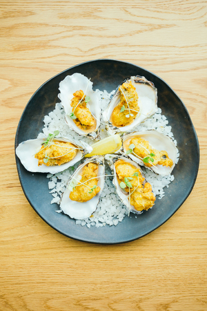 Fried oyster shell with sauce in plate - Color Filter Processingの写真素材
