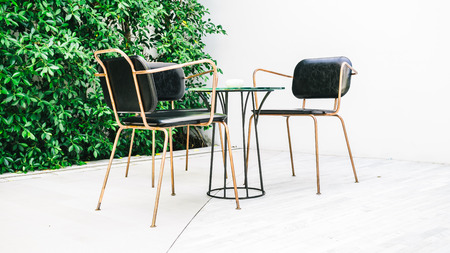 Furnitures with empty chair and table decoration around outdoor zone - Color Filter Processingの写真素材