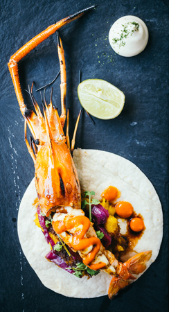 Taco with prawn or shrimp and sauce on black plate - Mexican food style , Color Filter Processingの写真素材