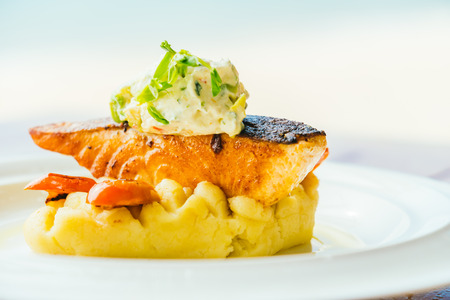 Grilled salmon meat fillet steak in white plate