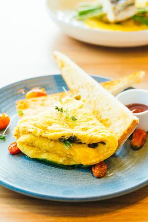 Spanich omelet with bread and tomato sauce for breakfastの写真素材