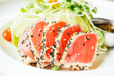 Raw fresh tuna meat with vegetable salad - Vintage light Filterの写真素材