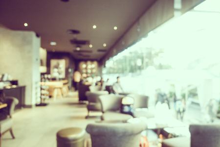 Abstract blur and defocused coffee shop and bakery cafe interior for background - Vintage Filterの写真素材