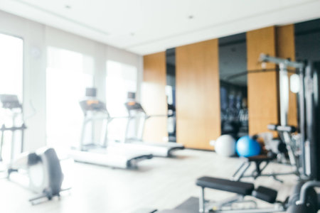 Abstract blur and defocused gym equipment and fitness room interior for backgroundの写真素材