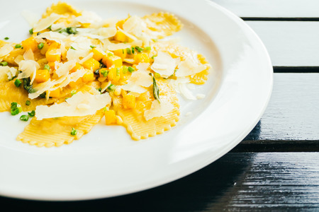 Ravioli pasta with pumpkin and cheese in white plateの写真素材