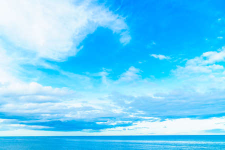 White cloud on blue sky  with seascape and ocean backgroundの写真素材