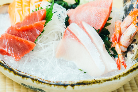 Raw and fresh salmon tuna and other sashimi fish meat - Japanese food styleの写真素材