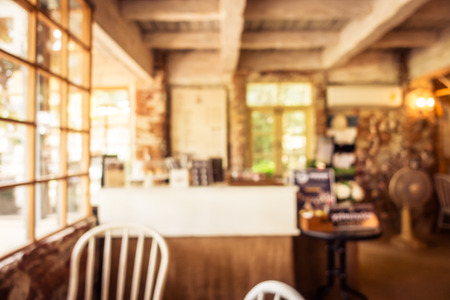 Abstract blur and defocused coffee shop cafe and restaurant interior for background - Vintage Filterの写真素材