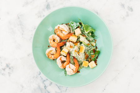 Caesar salad with shrimp or prawn in plate - Healthy food styleの写真素材