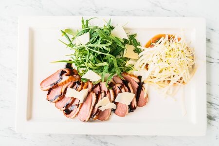 Grilled duck meat and breast salad in white plateの写真素材