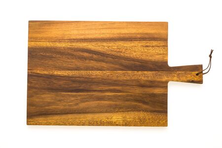 Brown wooden chopping and cutting board isolated on white backgroundの写真素材