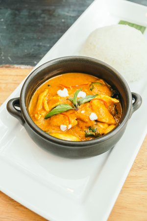 Panang curry chicken soup in black bowl with rice - Thai food styleの写真素材