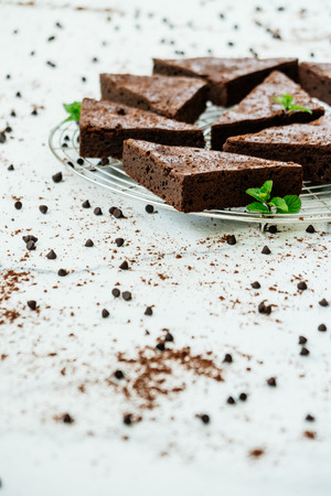 Sweet dessert with chocolate brownies on white stone backgroundの写真素材