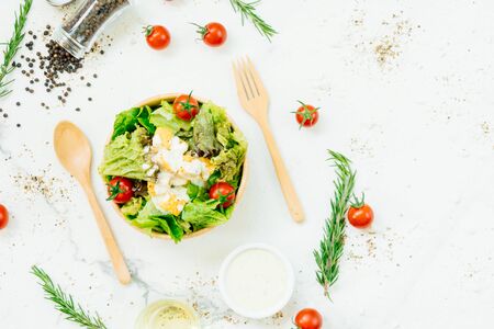 Clean and healthy food style with Caesar salad in wooden bowlの写真素材