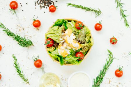 Clean and healthy food style with Caesar salad in wooden bowl