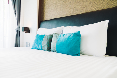 Pillow on bed decoration in bedroom interior with light lamp - Filter Processingの写真素材