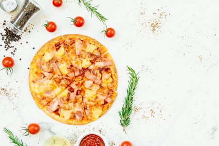 Hawaiian pizza with pineapple and ham - Unhealthy food styleの写真素材