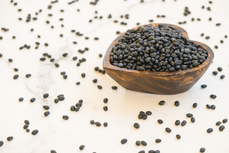 Black beans in wooden bowl - Healthy and Nutrition food conceptの写真素材