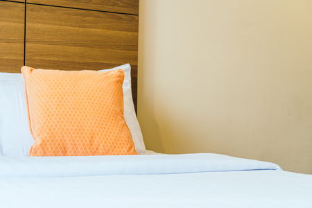 Comfortable pillow on bed decoration interior of hotel roomの写真素材