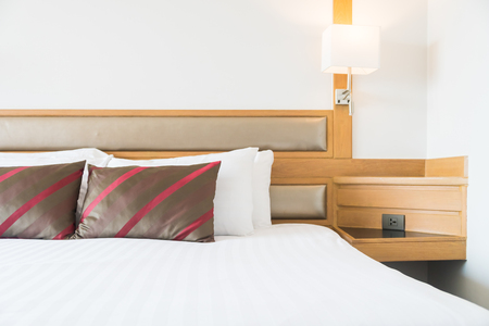 Comfortable pillow on bed decoration in bedroom interiorの写真素材