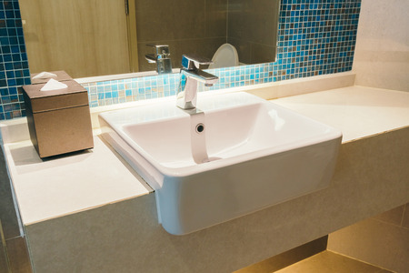 Faucet and sink decoration in bathroom interior