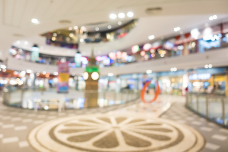 Abstract blur and defocused shopping mall in department store interior for backgroundの写真素材