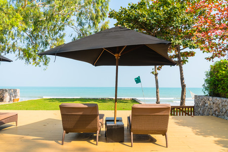 Umbrella and chair neary sea and beach - Vacation conceptの写真素材