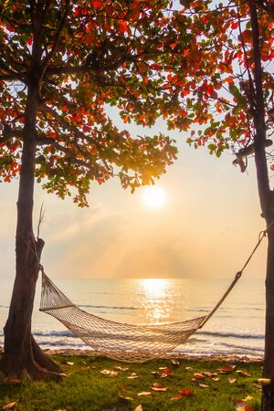 Hammock neary beach and sea on sunrise time - Vacation conceptの写真素材