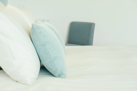 Comfortable pillow on bed decoration in hotel bedroom interior