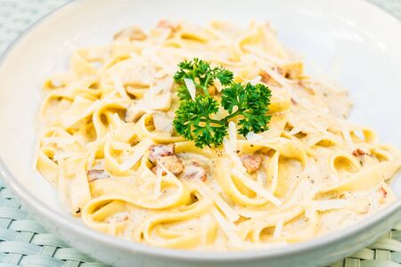 Spaghetti or Pasta with truffle and cream sauce in white plate - Italian food styleの写真素材