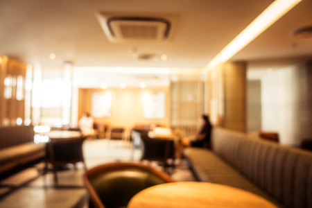 Abstract blur defocused coffee shop cafe and restaurant interior for backgroundの写真素材