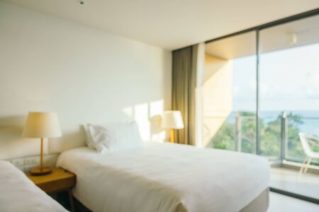 Abstract blur defocused hotel bedroom interior for backgroundの写真素材