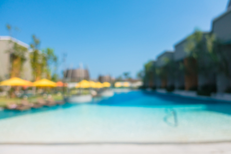 Abstract blur defocused swimming pool in luxury hotel resort for backgroundの写真素材