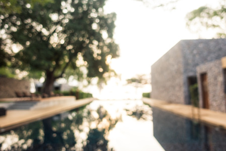 Abstract blur defocused swimming pool in luxury hotel resort for backgroundの写真素材