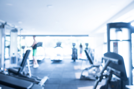 Abstract blur defocused fitness equipment and gym interior for backgroundの写真素材