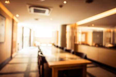 Abstract blur defocused coffee shop cafe and restaurant interior for backgroundの写真素材