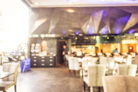 Abstract blur defocused coffee shop cafe and restaurant interior for backgroundの写真素材