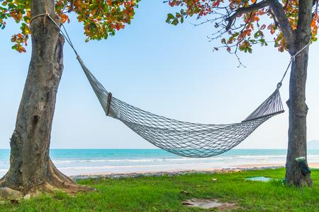 Empty Hammock on the beach and sea - Vacation conceptの写真素材