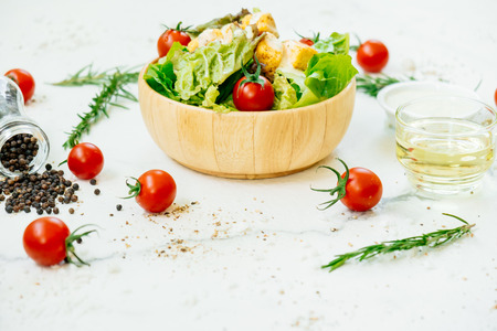 Clean and healthy food style with Caesar salad in wooden bowlの写真素材