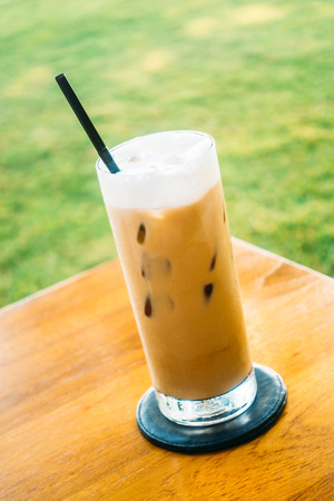 Iced coffee glass on wood tableの写真素材